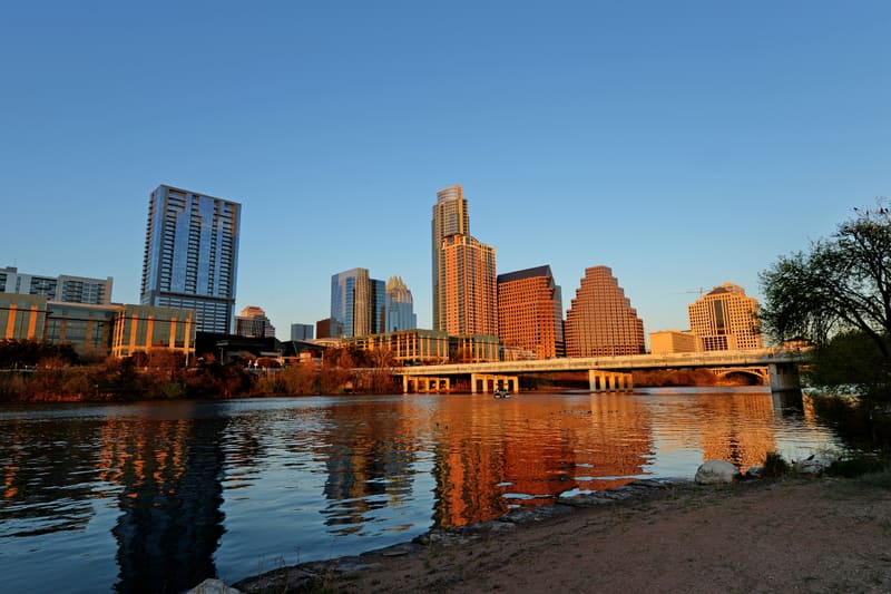 Downtown Austin, Texas skyline reflected in Lady Bird Lake at sunset